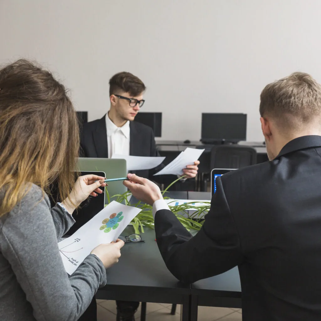 Team discussing project report